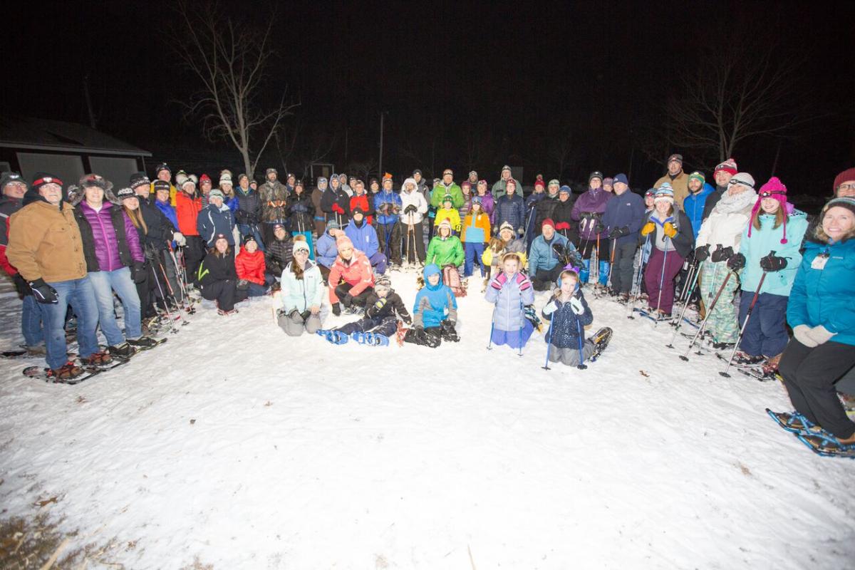 A group of people outside in the snow.
